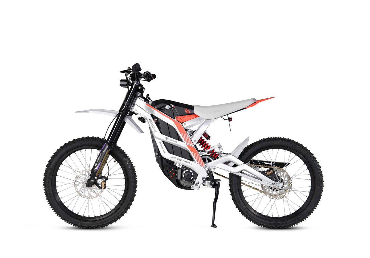 79BIKE Falcon Pro electric dirt bike featuring a white and black forged aluminum frame with red accents and knobby off-road tires