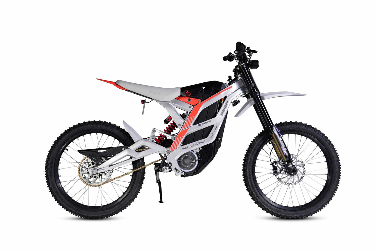 79BIKE Falcon Pro electric dirt bike with white and red forged aluminum frame, black suspension forks, and knobby off-road tires