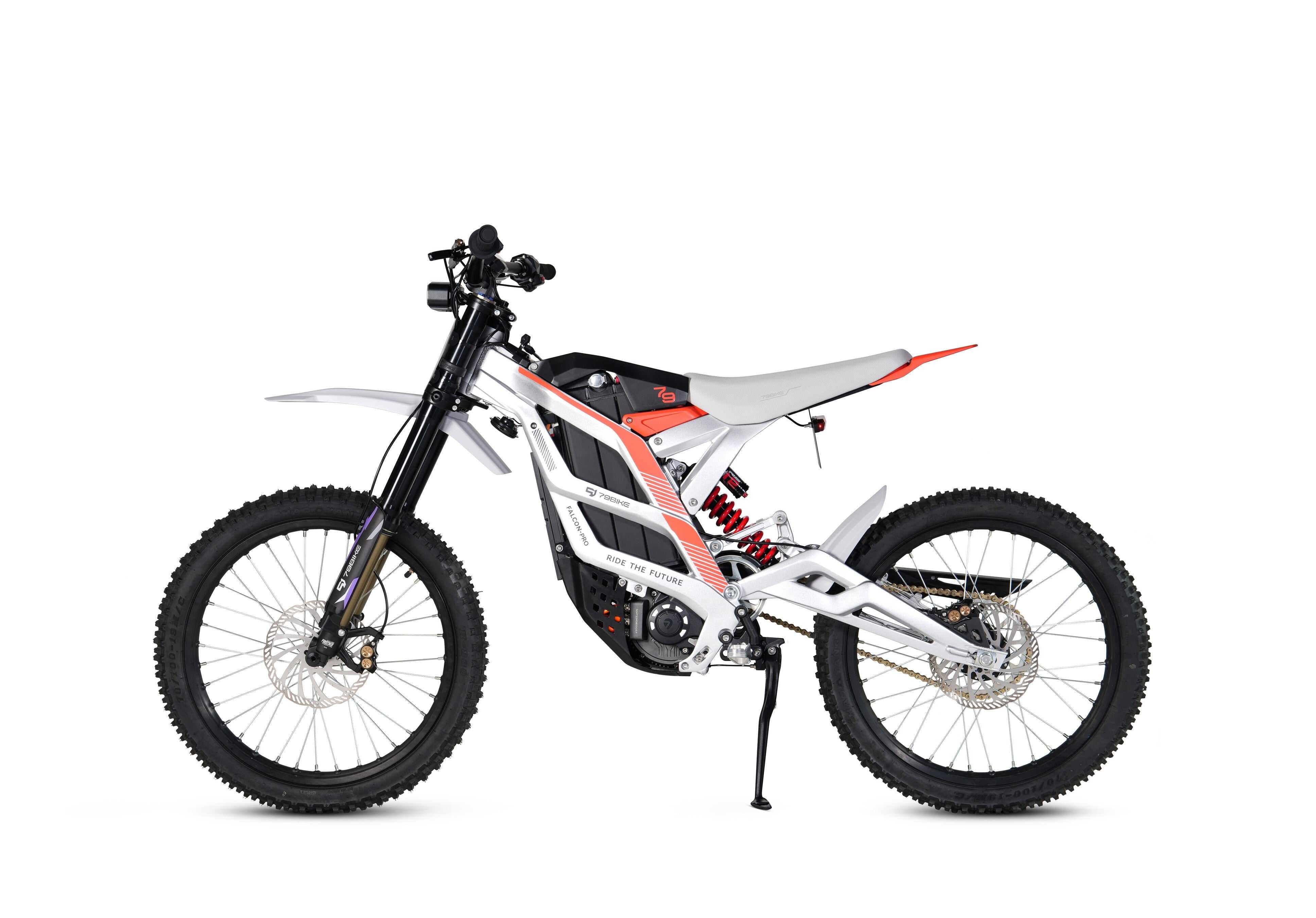 Front view of 79 Bike Falcon Pro approaching a steep climb with inverted fork suspension compressed for impact