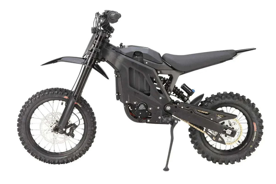 E Ride Pro Mini black electric dirt bike with knobby off-road tires, compact lightweight frame, and disc brakes