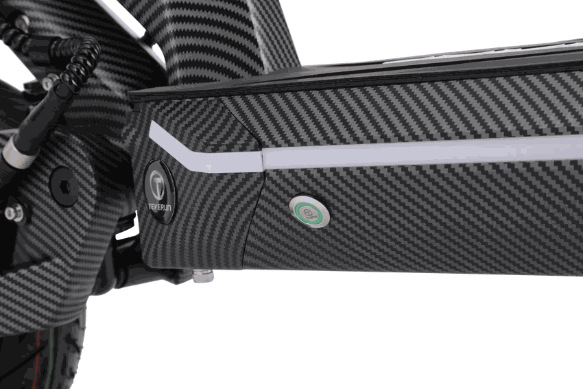 Teverun Fighter Mini Pro 2.0 electric scooter close-up of black carbon fiber-patterned frame with white LED strip and logos