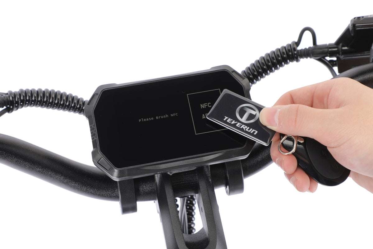 Teverun Fighter Mini Pro 2.0 electric scooter black digital display with NFC key card being held near screen for activation