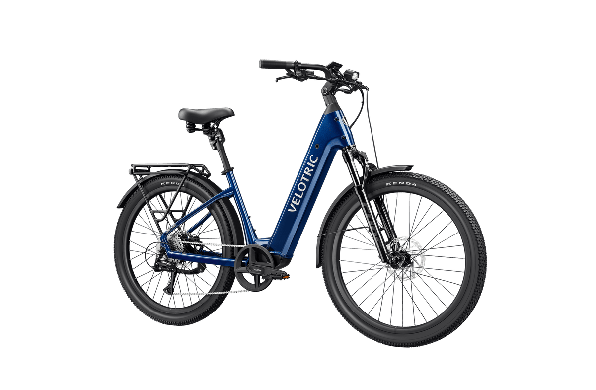 Velotric Discover 3 electric bike in metallic blue with step-through frame, black tires, and integrated rear rack